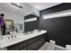 Contemporary bathroom with double sinks, sleek vanity, large mirror, and modern lighting at 2451 Cedar Fork Trl, Marietta, GA 30062
