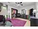 Bedroom includes a comfortable seating area, open closet and dresser with a full mirror at 2451 Cedar Fork Trl, Marietta, GA 30062