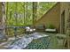 Spacious deck with outdoor seating, a grill, and views of the surrounding woods at 2451 Cedar Fork Trl, Marietta, GA 30062