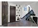 Foyer features hardwood floors, staircase, decorative mirror accents, and closet space at 2451 Cedar Fork Trl, Marietta, GA 30062