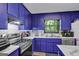 Updated kitchen with stainless appliances, white backsplash, and modern countertops at 2451 Cedar Fork Trl, Marietta, GA 30062