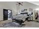 Comfortable main bedroom features a large bed, mirrors, bench and easy access to the outside at 2451 Cedar Fork Trl, Marietta, GA 30062