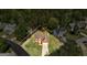Inviting two-story home featuring a well-manicured lawn and a classic brick facade, surrounded by lush greenery at 3612 River Mill Ct, Ellenwood, GA 30294