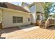 Back deck and yard featuring a wooden railing and mature trees at 3612 River Mill Ct, Ellenwood, GA 30294