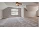 Large bedroom offering plush carpeting, neutral walls, and a bright window at 3612 River Mill Ct, Ellenwood, GA 30294
