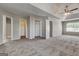 Expansive bedroom showcases a ceiling fan, large closets and neutral colored walls at 3612 River Mill Ct, Ellenwood, GA 30294