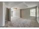 Primary bedroom features a tray ceiling, neutral paint, carpet and ample square footage at 3612 River Mill Ct, Ellenwood, GA 30294