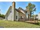 Exterior shot of the house from the backyard, featuring the deck and backyard at 3612 River Mill Ct, Ellenwood, GA 30294