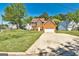 Two-story brick home featuring a well-manicured lawn and a two-car garage in a neighborhood setting at 3612 River Mill Ct, Ellenwood, GA 30294