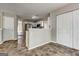Bright kitchen with white cabinets, stainless appliances, and unique flooring at 3612 River Mill Ct, Ellenwood, GA 30294