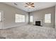 Bright, open living area with a fireplace and plenty of natural light at 3612 River Mill Ct, Ellenwood, GA 30294