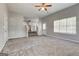 Spacious living area with stairs and a partial view of the kitchen at 3612 River Mill Ct, Ellenwood, GA 30294