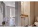 Half bath with a pedestal sink and a hallway view at 3612 River Mill Ct, Ellenwood, GA 30294
