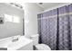 Bright bathroom with modern fixtures and stylish shower curtain at 736 Stagecoach Rd, Stockbridge, GA 30281