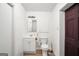 This bathroom features a white vanity, toilet, and a wood-look floor at 736 Stagecoach Rd, Stockbridge, GA 30281