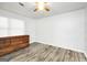 Clean bedroom featuring wood look floors and neutral walls at 736 Stagecoach Rd, Stockbridge, GA 30281