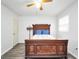 Bedroom featuring wood look floors, a door and neutral walls at 736 Stagecoach Rd, Stockbridge, GA 30281