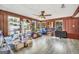 Spacious bonus room with wood paneling, a ceiling fan and lots of natural light at 736 Stagecoach Rd, Stockbridge, GA 30281