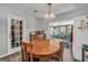 Dining area with table and chairs, vintage light fixture, and sliding door access to the exterior at 736 Stagecoach Rd, Stockbridge, GA 30281