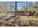 Charming single-story home featuring a brick facade, covered porch, and attached two-car garage at 736 Stagecoach Rd, Stockbridge, GA 30281