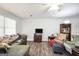 Bright living room with hardwood floors, ceiling fan and neutral decor at 736 Stagecoach Rd, Stockbridge, GA 30281