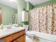 Full bathroom with neutral colors, vanity sink, and shower-tub combo at 121 Cotton Indian Trl, Stockbridge, GA 30281