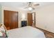 Bedroom with ceiling fan, closet, neutral color palette, and comfortable quilt at 121 Cotton Indian Trl, Stockbridge, GA 30281