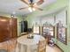 Cozy kitchen dining area features bright lighting, a ceiling fan, and access to other rooms at 121 Cotton Indian Trl, Stockbridge, GA 30281