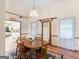 Bright dining area with a wooden table, an accent rug, and convenient access to the kitchen at 121 Cotton Indian Trl, Stockbridge, GA 30281