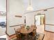 Cozy dining area featuring a wooden table for four, adjacent to the living room and kitchen at 121 Cotton Indian Trl, Stockbridge, GA 30281