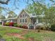 A charming home with stone accents and beautiful landscaping creating an inviting curb appeal at 121 Cotton Indian Trl, Stockbridge, GA 30281