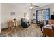Comfortable living room featuring plush recliner, natural light, and classic ceiling fan at 121 Cotton Indian Trl, Stockbridge, GA 30281