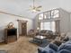 Inviting living room with vaulted ceilings, large windows, and comfortable seating at 121 Cotton Indian Trl, Stockbridge, GA 30281