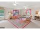 Inviting living room with plush seating, a decorative rug, and ample natural light at 121 Cotton Indian Trl, Stockbridge, GA 30281