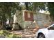 Exterior showcasing a single-story house with brick and weathered facade in natural setting at 346 Schoen Se St, Atlanta, GA 30315