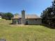 View of the backyard and patio at 10119 Commons Way, Jonesboro, GA 30238
