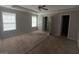 Bright bedroom featuring natural light, carpet flooring, and ceiling fan at 10119 Commons Way, Jonesboro, GA 30238