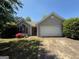 Charming single-story home featuring a well-maintained yard, a two-car garage, and inviting curb appeal at 10119 Commons Way, Jonesboro, GA 30238
