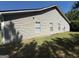 Exterior elevation showing vinyl siding and grassy yard at 10119 Commons Way, Jonesboro, GA 30238
