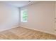 Neutral bedroom featuring a large window and plush carpeting at 5318 Tolar Rd # 25, South Fulton, GA 30213