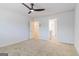 Light filled bedroom features ceiling fan, carpet and doorway to bath at 5318 Tolar Rd # 25, South Fulton, GA 30213