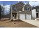 Charming two-story brick home with two-car garage and traditional design in a residential neighborhood at 5318 Tolar Rd # 25, South Fulton, GA 30213