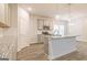 Modern kitchen with granite countertops, stainless steel appliances, island, and hardwood floors at 5318 Tolar Rd # 25, South Fulton, GA 30213