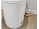 A modern white toilet with wood floors at 5318 Tolar Rd # 25, South Fulton, GA 30213