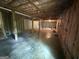 Unfinished basement with exposed ceiling beams and concrete floor at 191 Tumlin Creek Rd # 1, Roopville, GA 30170