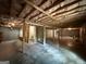 Unfinished basement with exposed beams, concrete walls, and flooring, ready for customization at 191 Tumlin Creek Rd # 1, Roopville, GA 30170