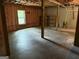 Spacious unfinished basement with support beams and exposed framework at 191 Tumlin Creek Rd # 1, Roopville, GA 30170