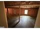 Unfinished basement area showing concrete floors, exposed insulation, and support beams at 191 Tumlin Creek Rd # 1, Roopville, GA 30170
