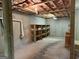 Unfinished basement with concrete walls, offering storage and expansion potential at 191 Tumlin Creek Rd # 1, Roopville, GA 30170