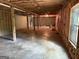 Spacious unfinished basement featuring a concrete floor and exposed insulation at 191 Tumlin Creek Rd # 1, Roopville, GA 30170